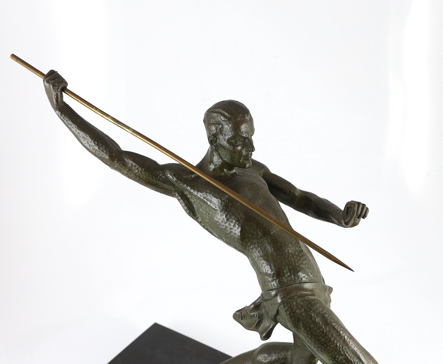 Limousin. A French Art Deco patinated spelter figure of a javelin thrower, 65cm wide, 55cm high